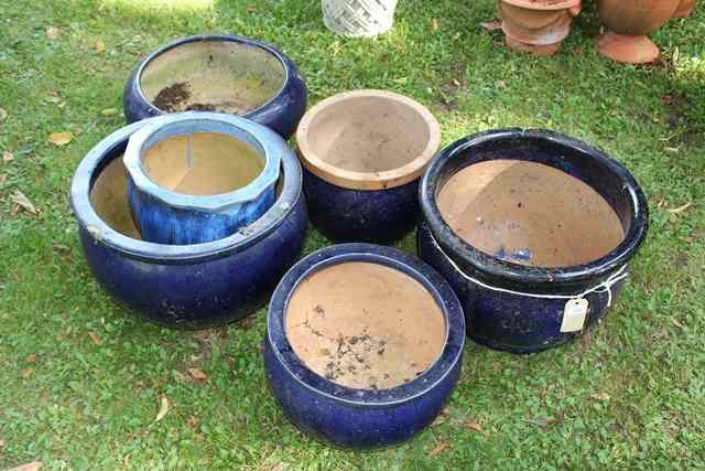 Appraisal: A GROUP OF SIX BLUE GLAZED SHALLOW PLANT POTS