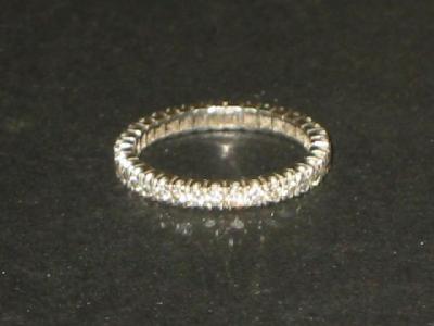 Appraisal: A DIAMOND FULL ETERNITY RING the brilliant cut diamonds claw