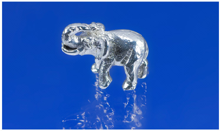 Appraisal: Miniature Silver Novelty Elephant Ears forward and trumpeting Fully hallmarked