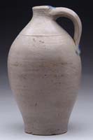 Appraisal: SMALL OVOID STONEWARE JUG - h blue highlights around handle