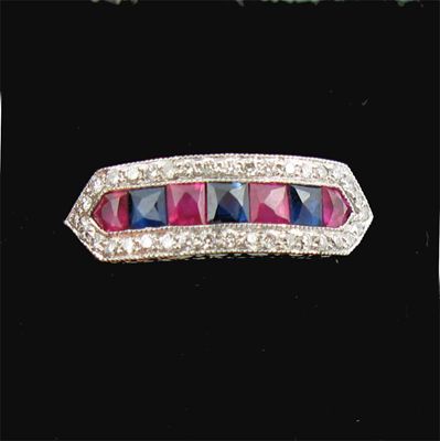 Appraisal: A ruby and sapphire half hoop ring alternately set with