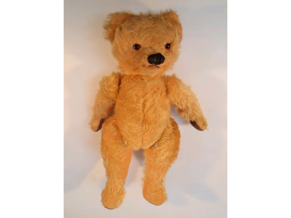 Appraisal: A yellow plush Teddy bear with mechanised mouth and articulated