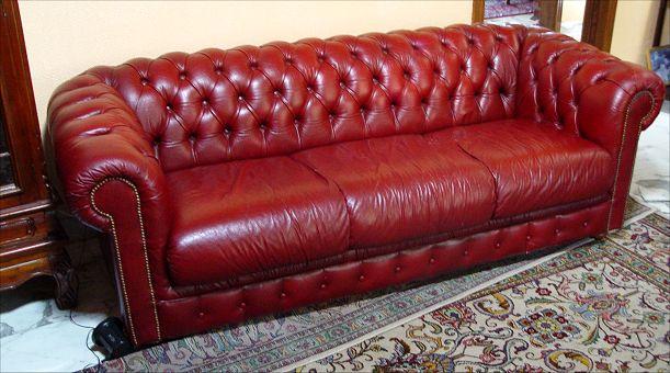 Appraisal: RED LEATHER CHESTERFIELD SOFA Richly worn to nice patina Brass