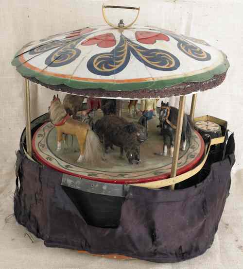 Appraisal: Painted metal and wood carousel mid th c with miscellaneous