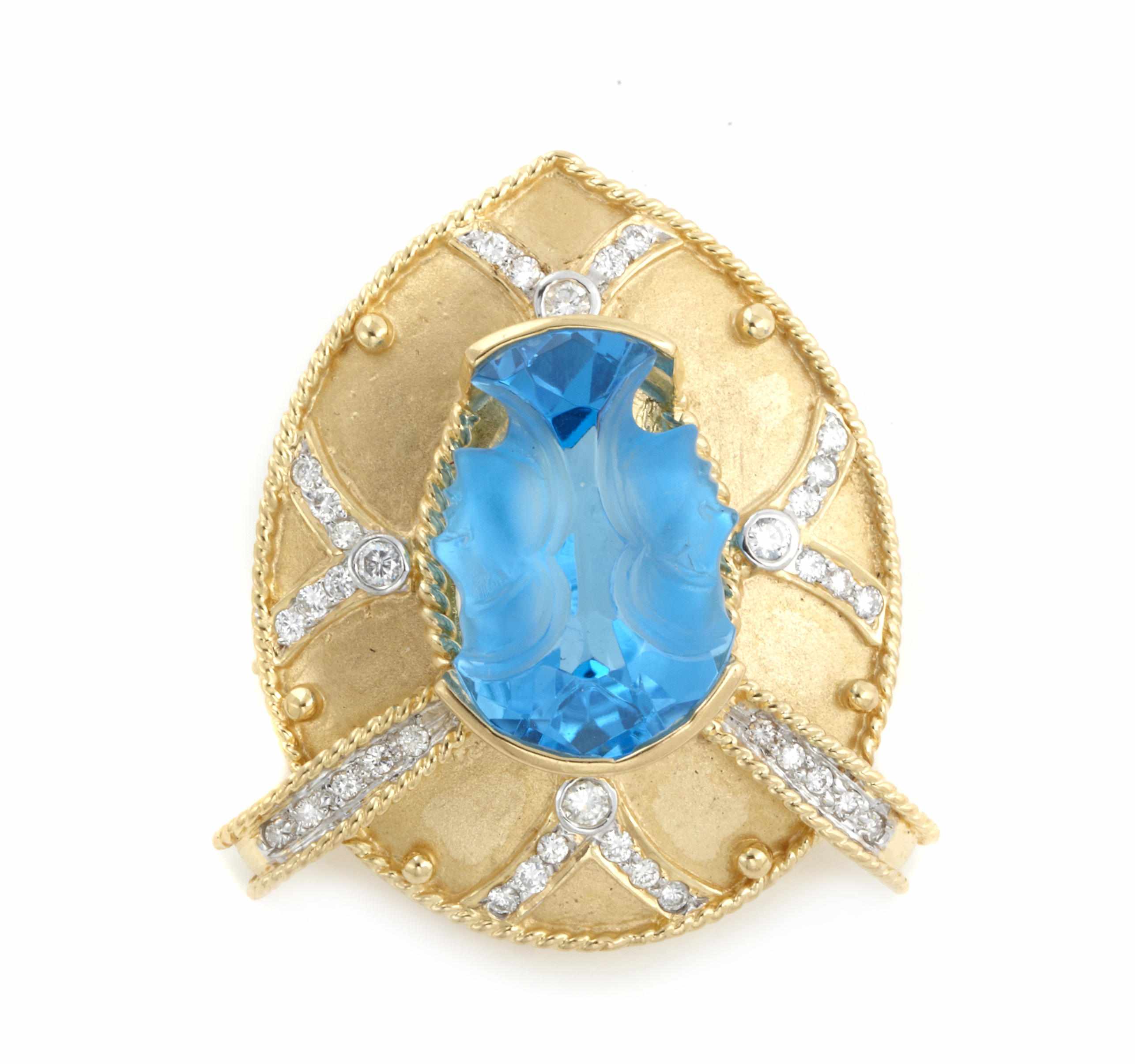 Appraisal: A carved topaz diamond and k gold pendant-brooch carved topaz