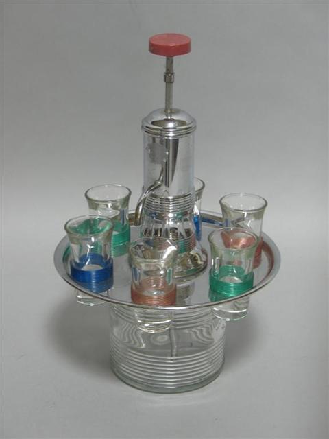 Appraisal: RETRO CHROME AND GLASS COCKTAIL SET With central push handle