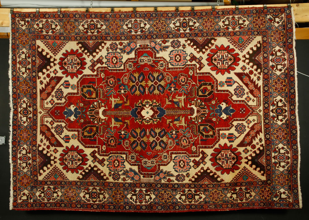 Appraisal: - Persian Wool Carpet Persian carpet handwoven with wool pile