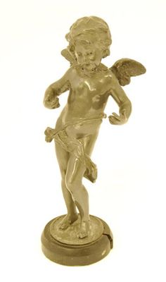 Appraisal: A lead figure of a standing cherub on an ebonised