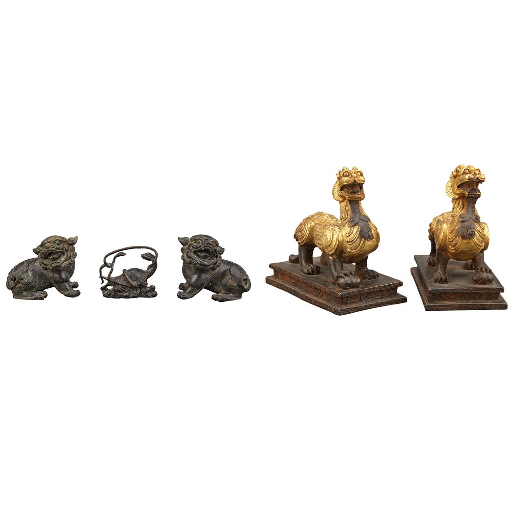 Appraisal: Group of Chinese Bronze Mythical Animals Comprising a pair of