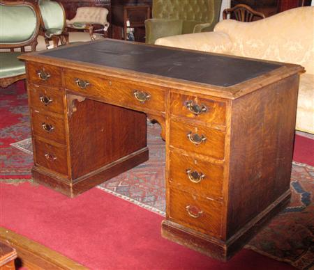 Appraisal: A Victorian oak twin pedestal desk the moulded rectangular top