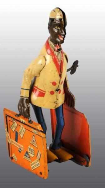 Appraisal: Tin Distler Baggage Handler Wind-Up Toy Description German Working African