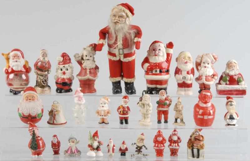 Appraisal: Large Lot of Santa Ornaments Candy Containers Description Circa s