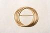 Appraisal: BROOCH - K yellow gold circle brooch composed of four