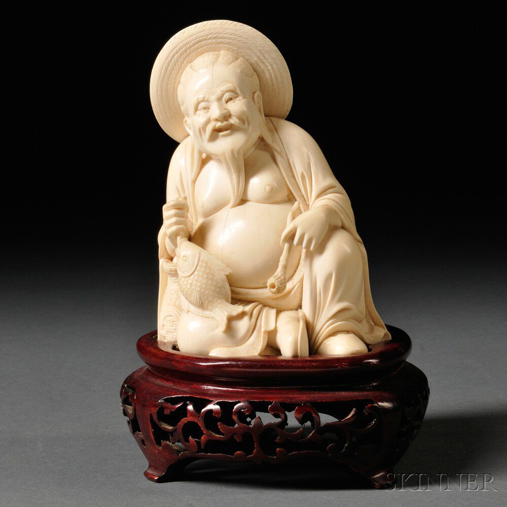 Appraisal: Ivory Carving of a Fisherman China th century holding a