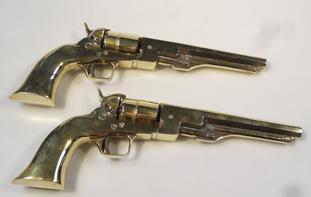 Appraisal: A pair of novelty brass wall hanging Colt revolvers with