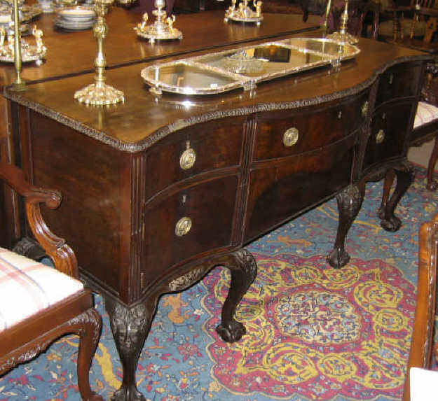 Appraisal: ENGLISH CHIPPENDALE STYLE MAHOGANY SIDEBOARD Shaped top with foliate carved