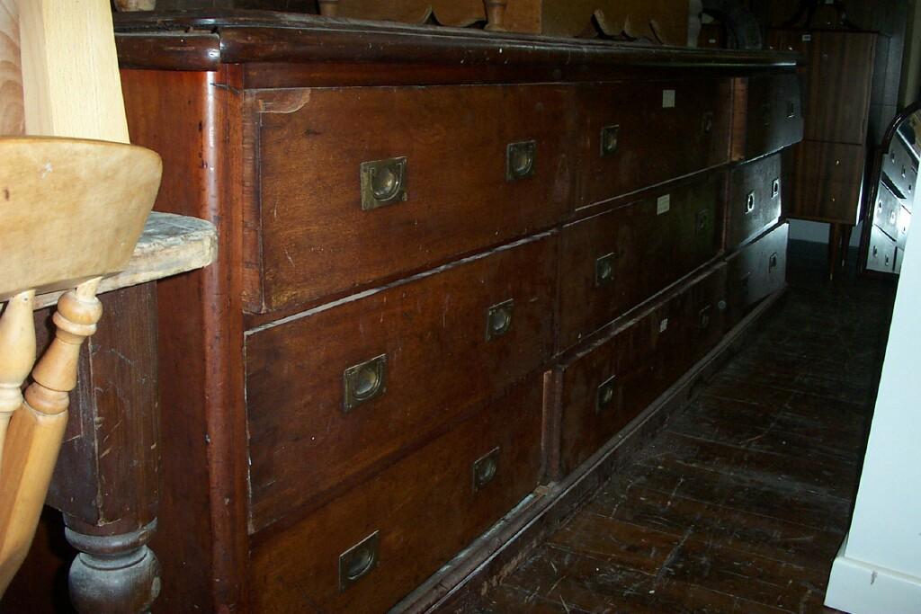 Appraisal: A substantial Victorian mahogany counter fitted with long drawers with