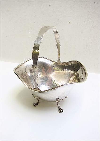 Appraisal: SHREIVE CO STERLING SILVER FOOTED BASKET with hammered design ruffled