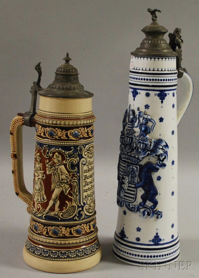 Appraisal: Two German Pewter-lidded Ceramic Steins a cobalt-decorated ceramic stein with