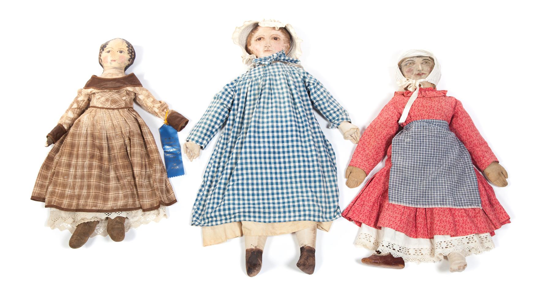 Appraisal: THREE CLOTH DOLLS WITH OIL PAINTED FACES American nd half-