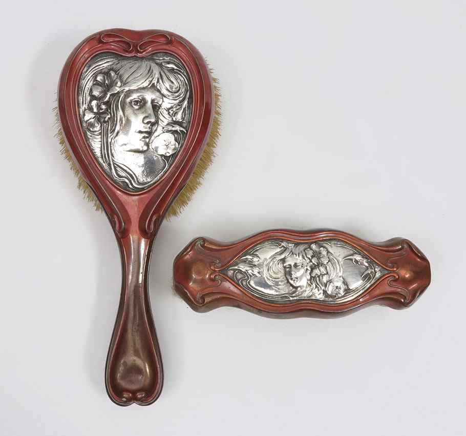 Appraisal: ART NOUVEAU STERLING SILVER BRUSHES Mixed metal hairbrush and clothes