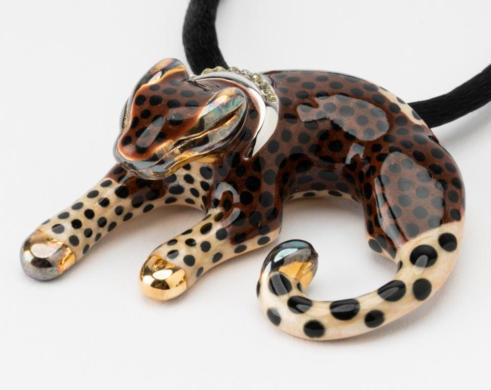 Appraisal: SILVER-GILT ENAMEL PANTHER PENDANTSet with one single cut round diamond