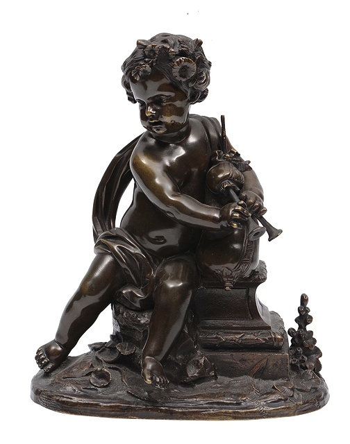 Appraisal: A BRONZE AFTER THE ANTIQUE of a cherub playing pipes