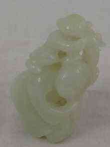 Appraisal: A Chinese jade carving of a woman carrying a child