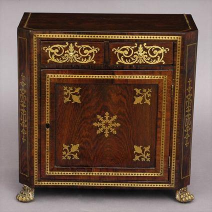 Appraisal: REGENCY BRASS-INLAID ROSEWOOD MINIATURE SIDE CABINET The line-inlaid top with