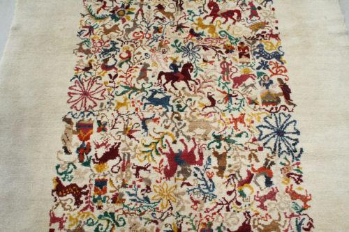 Appraisal: HAND TIED TURKISH PICTORIAL RUG Showing colorful horses riders leopards