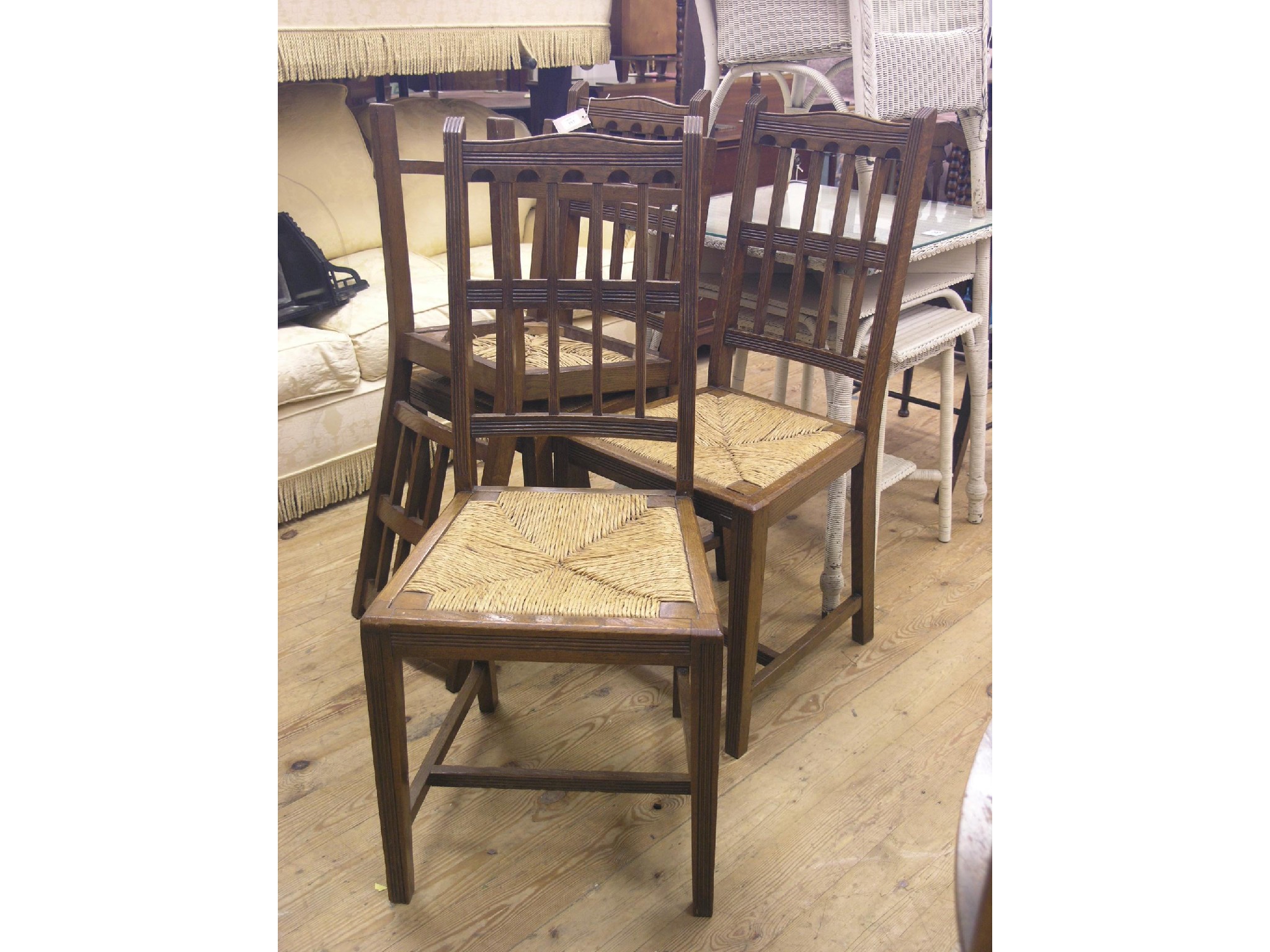 Appraisal: A set of four early th century oak dining chairs