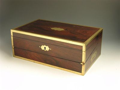 Appraisal: A late Regency rosewood and brass bound writing slope with