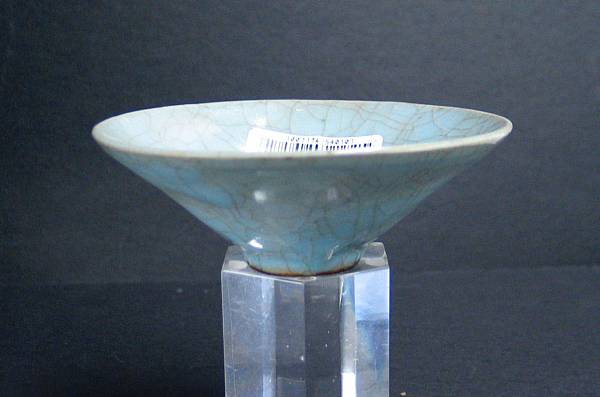 Appraisal: A crackle glazed conical porcelain chawan Imitating the shape and