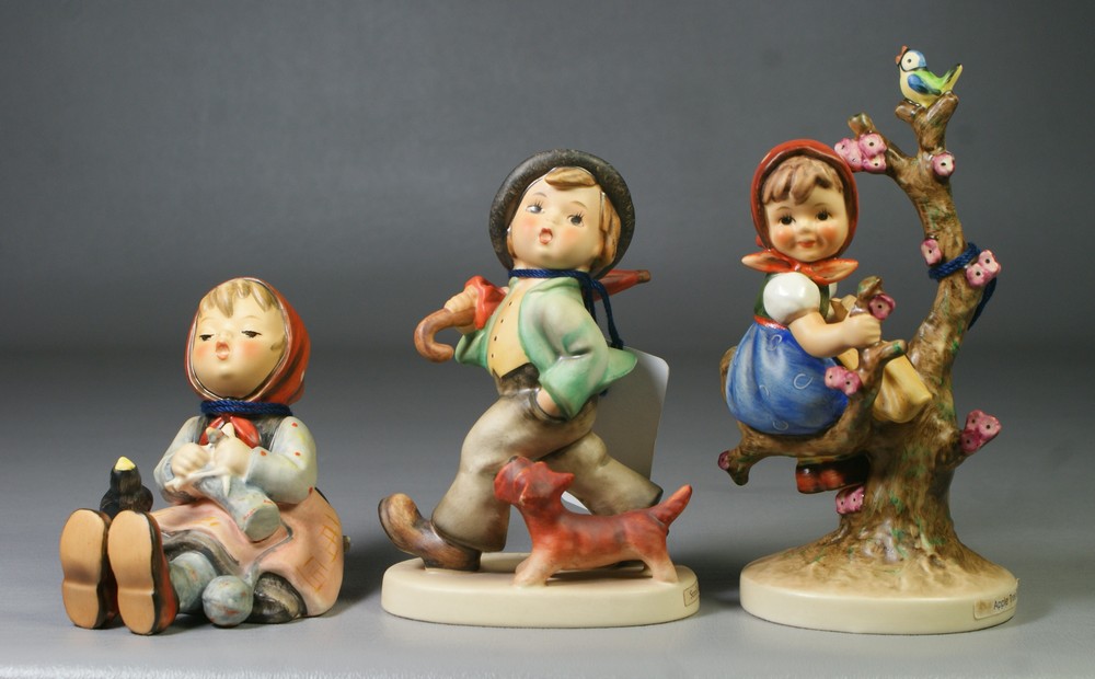 Appraisal: Goebel Hummel figurines Apple Tree Girl Hum Strolling Along Hum