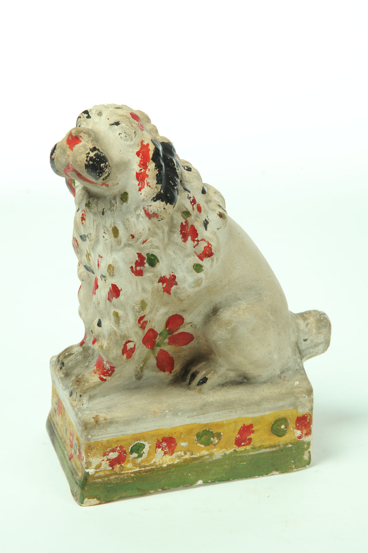 Appraisal: CHALKWARE DOG American late th century Seated shaggy dog with