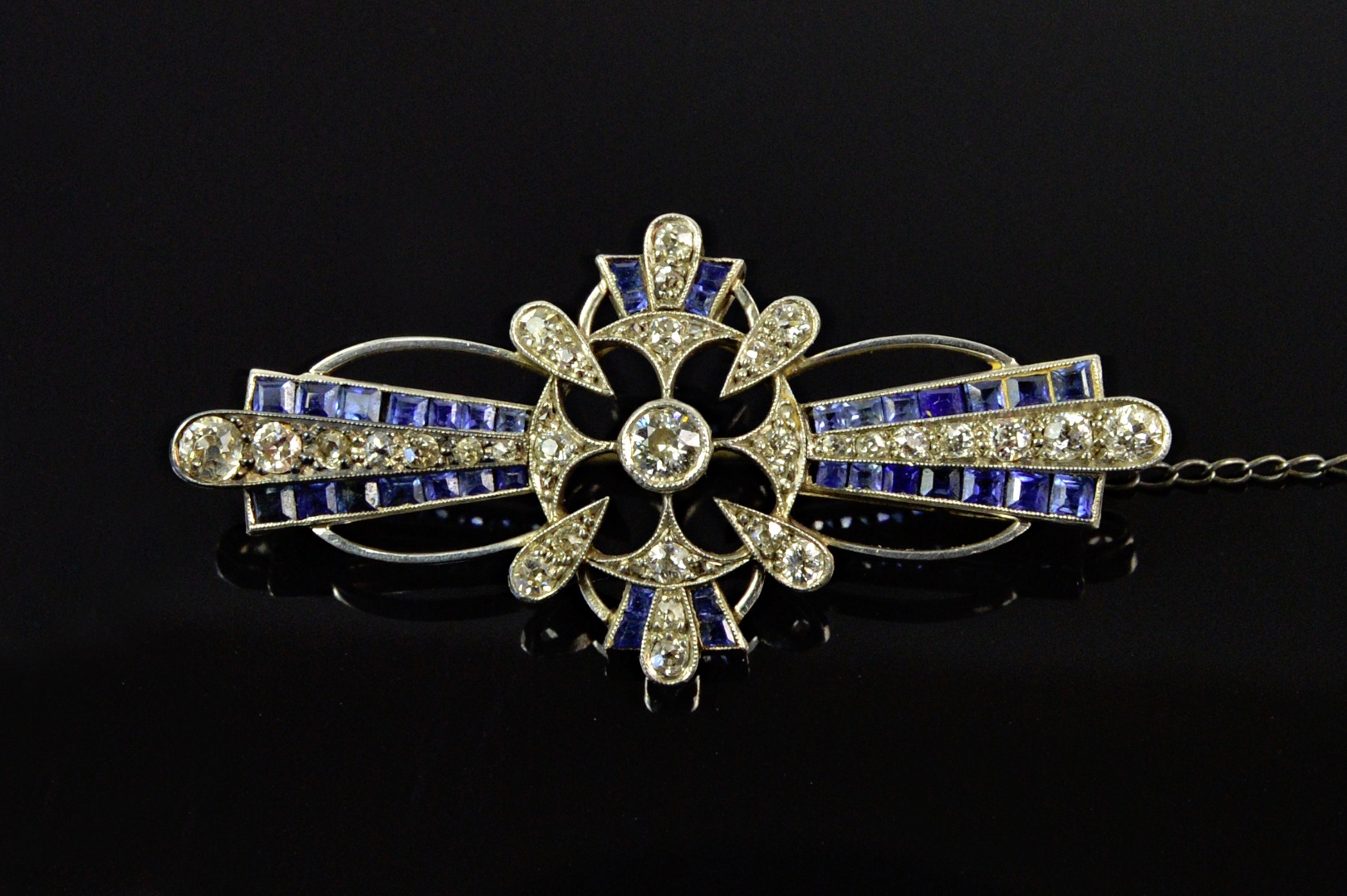 Appraisal: A sapphire and diamond brooch early th century centred by