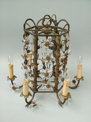 Appraisal: A Continental gilt metal open cage six light chandelier on