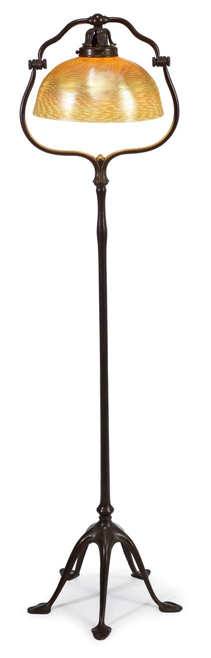 Appraisal: Patinated bronze floor lamp with a favrile shadetiffany studios new