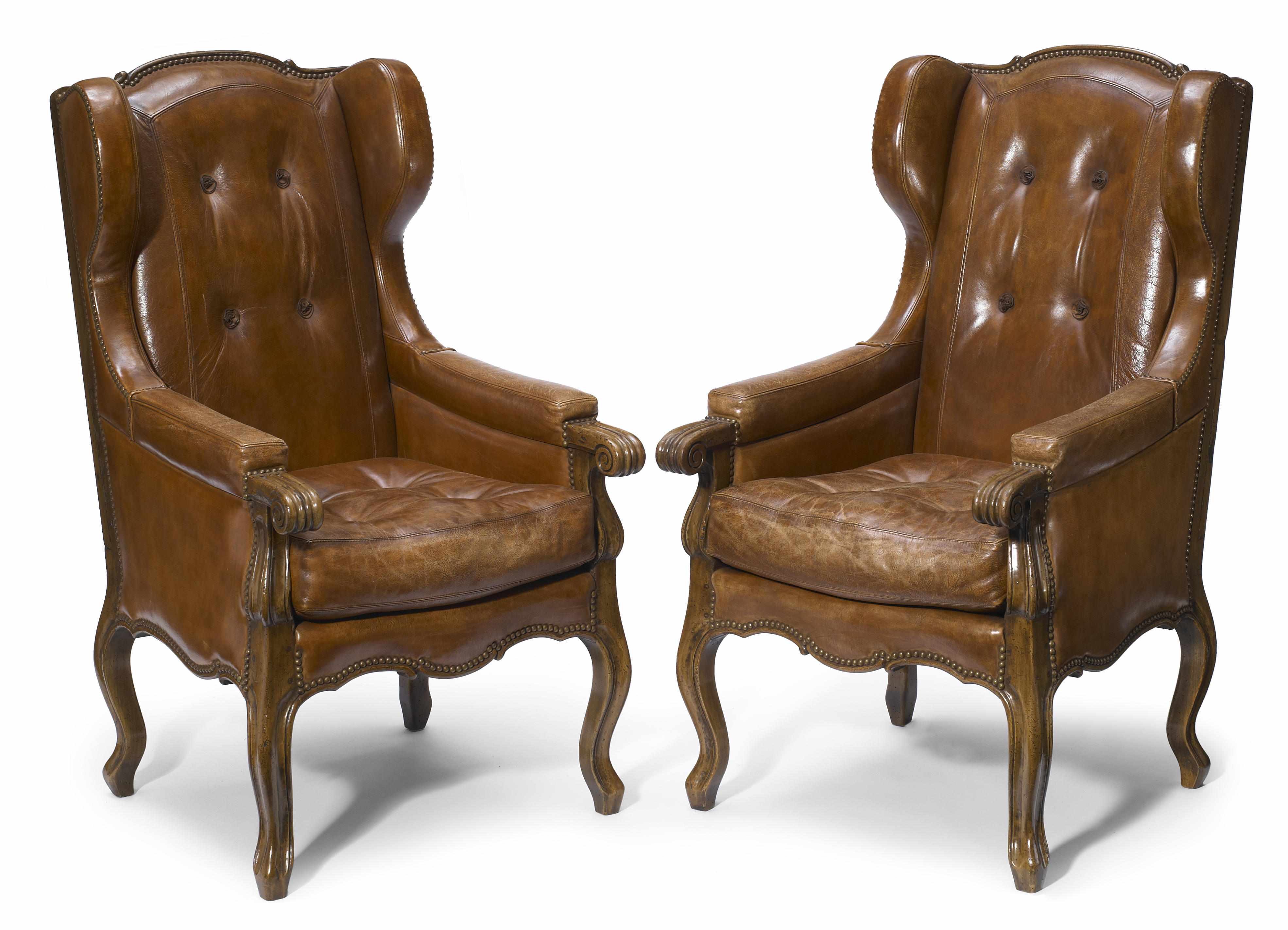 Appraisal: A pair of Louis XV style carved walnut and leather