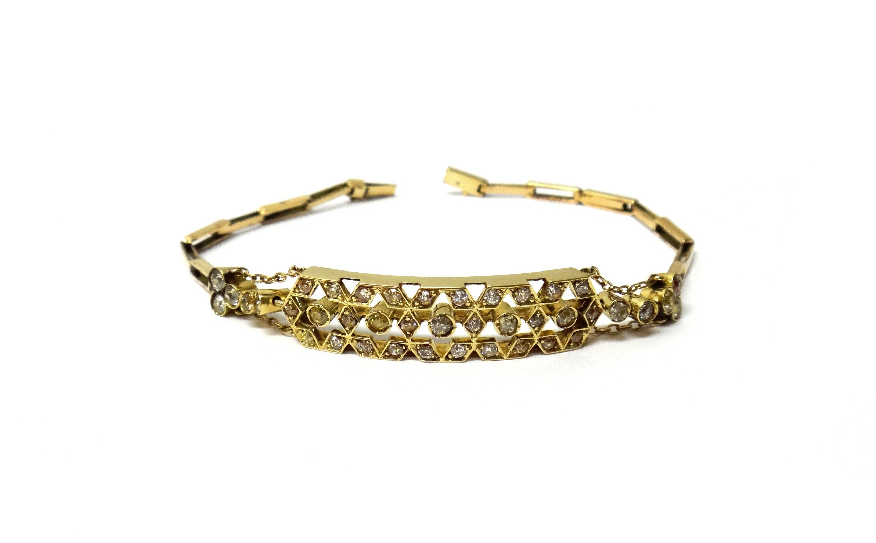 Appraisal: A gold and diamond set bracelet the front in a