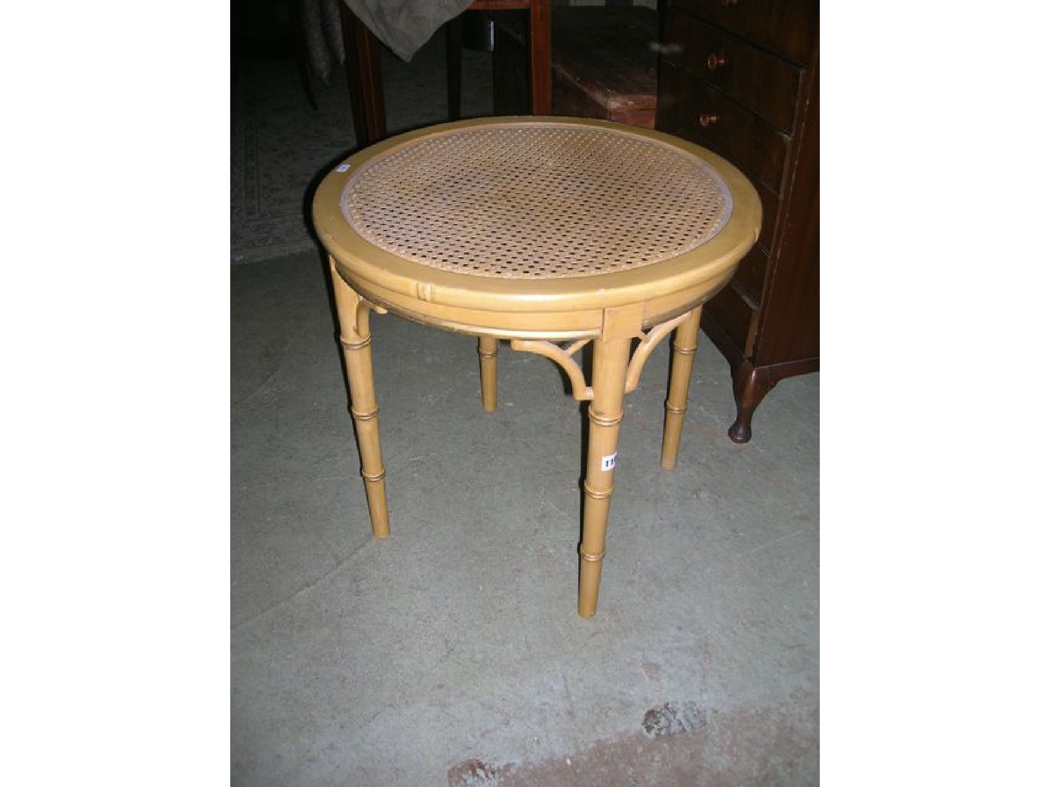 Appraisal: A contemporary occasional table of circular form with cane panelled