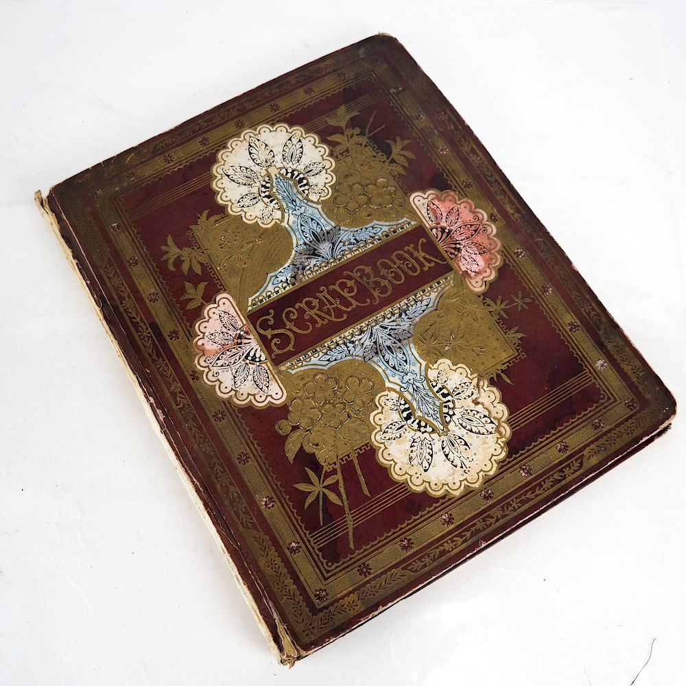 Appraisal: Victorian Scrapbook Leather-embossed jacket scrapbook containing various advertising color offset