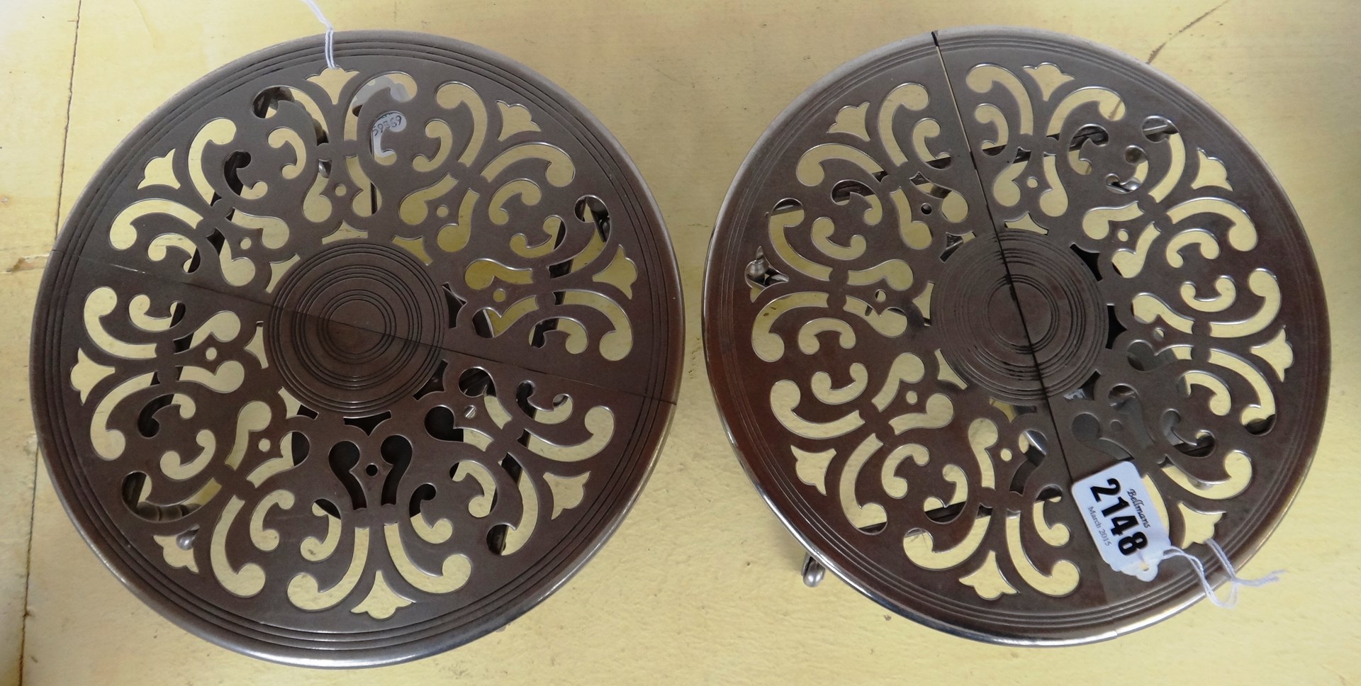 Appraisal: A pair of expanding table trivets early th century each