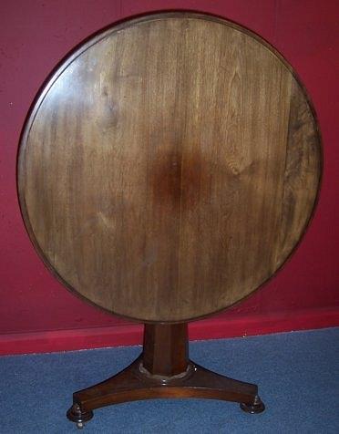 Appraisal: An early Victorian circular table raised on an octagonal tapered