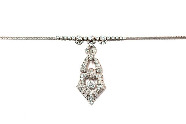 Appraisal: A white gold and diamond set pendant necklace the front