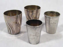 Appraisal: A mixed lot comprising four German silver vodka tots