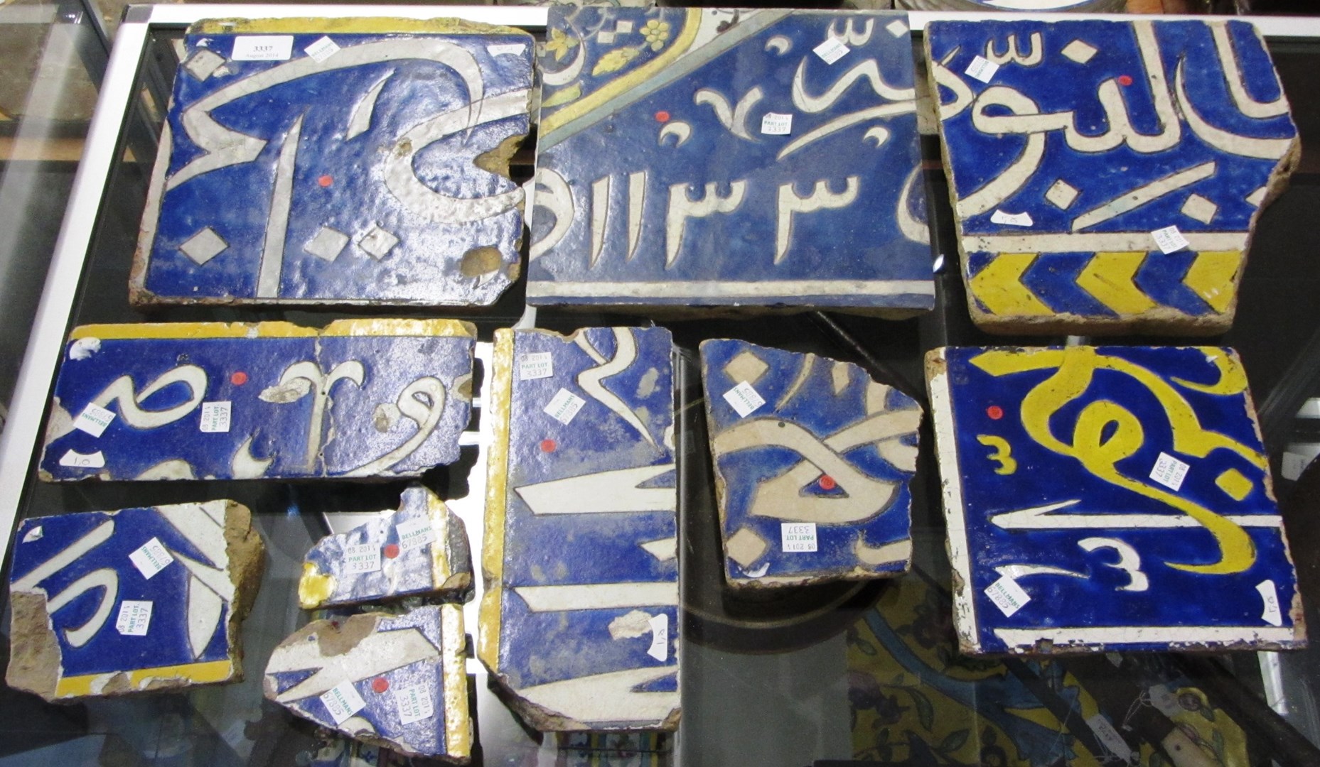 Appraisal: Ten safavid calligraphic pottery tiles and tile fragments Iran one