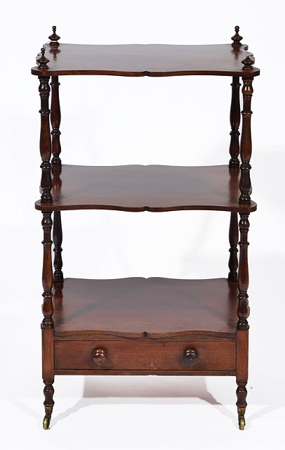 Appraisal: A VICTORIAN MAHOGANY THREE TIER WHATNOT with serpentine edges turned