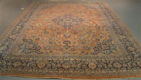 Appraisal: KASHAN NAVY AND CORAL GROUND RUG w d in