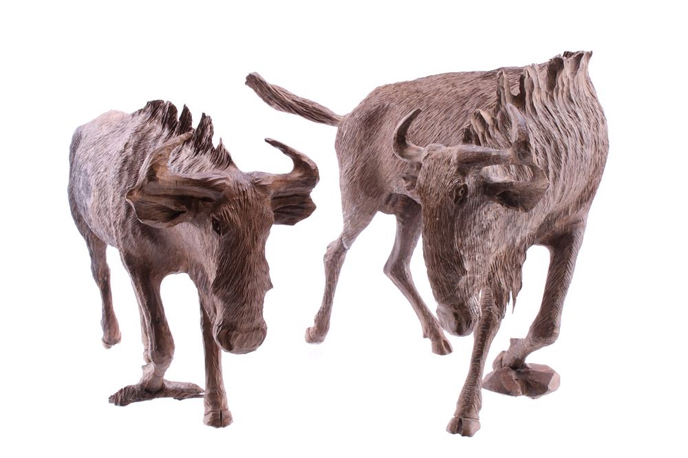 Appraisal: South African Carved Leadwood Wildebeest Pair Featured in this lot